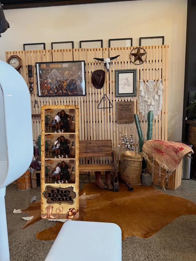 The photo booth set up in a venue beside a styled display.